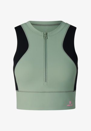 Sleeveless sports crop top in sage green with black side panels, front zipper, and small pink "Fire + Ice" logo near bottom hem.