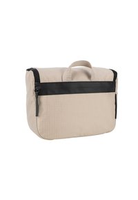 Béžová látková taška s černým zipem a popruhem. Zaoblené rohy, horní madlo a jemně texturovaný vzor na povrchu.