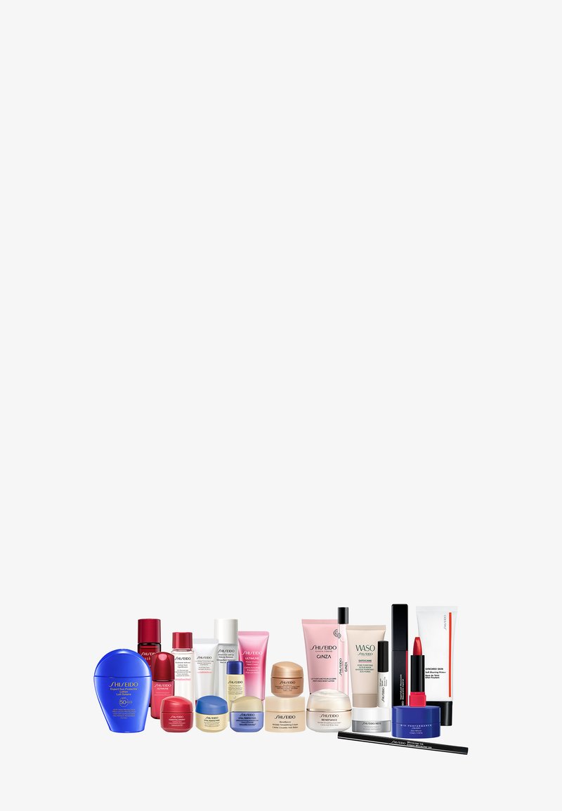 Kolekcja produktów do pielęgnacji skóry i makijażu Shiseido w różnych kształtach i rozmiarach, w tym niebieskie, czerwone i białe plastikowe pojemniki oraz tubki.