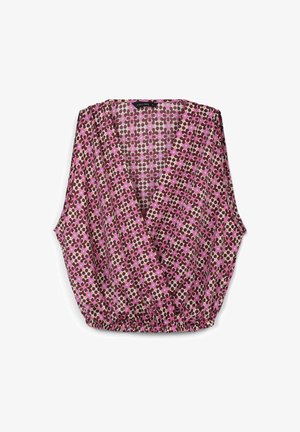 Top floreale con scollo a v e maniche corte e larghe. Presenta un motivo rosa, marrone e crema. Orlo elastico in vita per un effetto arricciato.