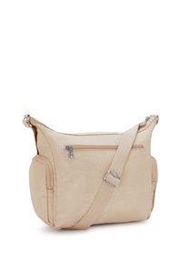 Borsa a tracolla beige con tracolla regolabile, tasca frontale con zip e due compartimenti laterali con zip su sfondo bianco.