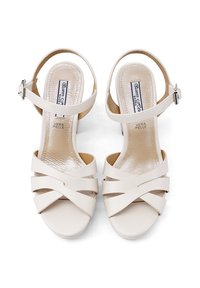 Sandali con tacco alto in pelle bianca, con fibbie incrociate, punta aperta e cinturino alla caviglia. Finitura liscia con soletta imbottita.