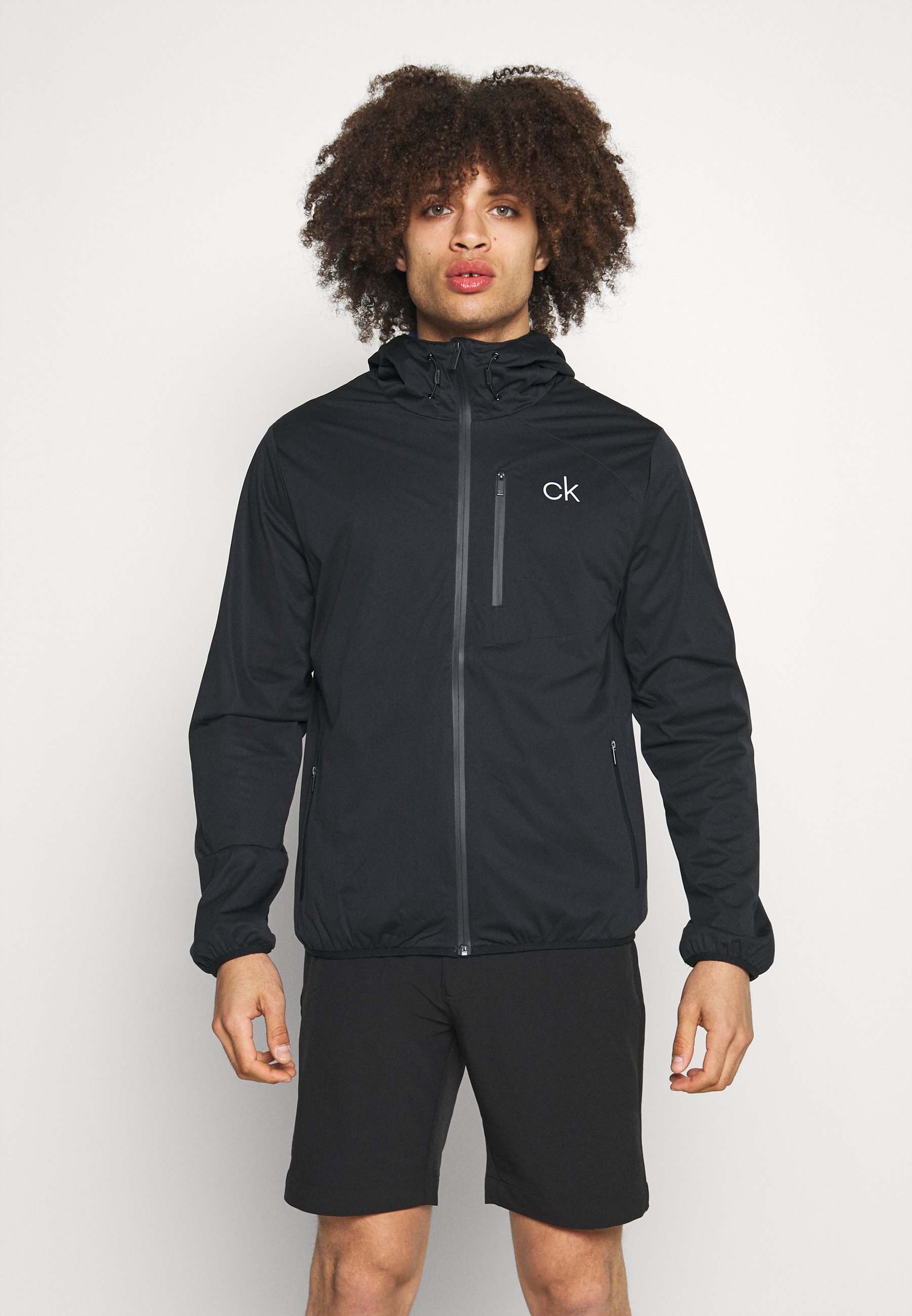 Calvin Klein Golf ULTRON HOODED JACKET - Waterproof jacket - navy/dark blue  