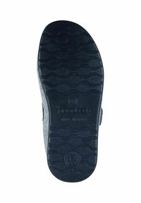 Black rubber shoe sole with textured wave pattern, grey felt upper edge, and branding "made in Italy" embossed on the sole.