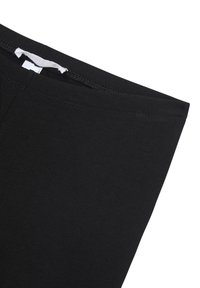 Leggings neri realizzati in un morbido misto cotone elasticizzato, caratterizzati da una superficie liscia, una fascia in vita ampia e senza cuciture visibili. Design semplice.