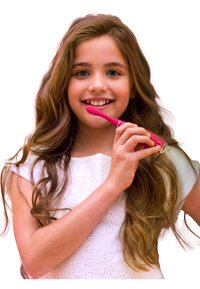 Electric toothbrush with a pink silicone head, smooth handle, and gold accent, held by a girl with long brown hair wearing a white top.