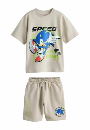 Beige toddler outfit with Sonic the Hedgehog graphic tee showing Sonic in motion and matching shorts with Sonic emblem and text.