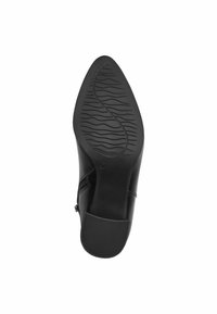 Black leather shoe with a textured rubber sole, featuring a wavy pattern for grip. Side zipper and smooth finish on upper material.
