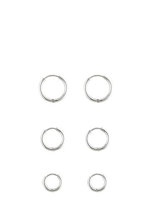 Six pairs of silver hoop earrings in three different sizes arranged in two vertical columns on a white background.