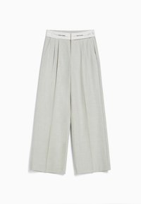 Light gray wide-leg trousers with front pleats and a solid waistband labeled "TOO CLOSE." Made from a smooth, textured fabric.