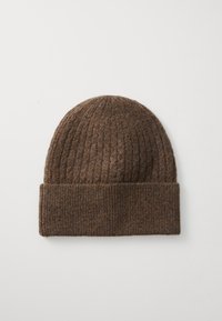 Brown ribbed knit beanie made from soft material, featuring a folded cuff and a rounded top for a snug fit.