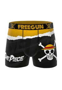 Boxers noirs avec une ceinture élastique jaune portant le logo "FREEGUN". Le design inclut un crâne avec un chapeau de paille et le texte "One Piece".