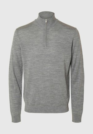 Grå genser med glidelås i kragen, laget av et glatt, strukturert stoff. Har lange ermer og en tettsittende design.