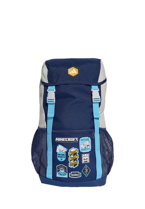 Laivastonsininen ja harmaa reppu, jossa vaaleansiniset olkahihnat, verkkopuolen taskut ja Minecraft-aiheiset merkit etutaskussa.