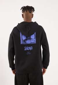 Black hoodie featuring a large graphic of a CD and text in blue on the back, with a drawstring hood and ribbed cuffs and hem.