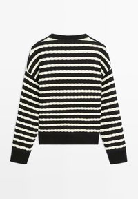 Černobíle pruhovaný svetr s dlouhými rukávy, ribbená manžeta a strukturovaný pletený design. Krátká délka s kulatým výstřihem.