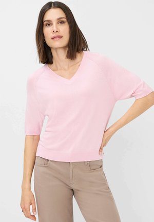 Helles rosa kurzärmliges V-Ausschnitt-Pullover mit lockerer Passform und geripptem Saum. Strukturiertes Detail an den Ärmeln sorgt für dezentes visuelles Interesse.