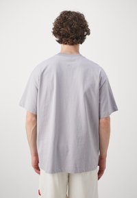 adidas Performance TEE - Camiseta estampada - glory grey