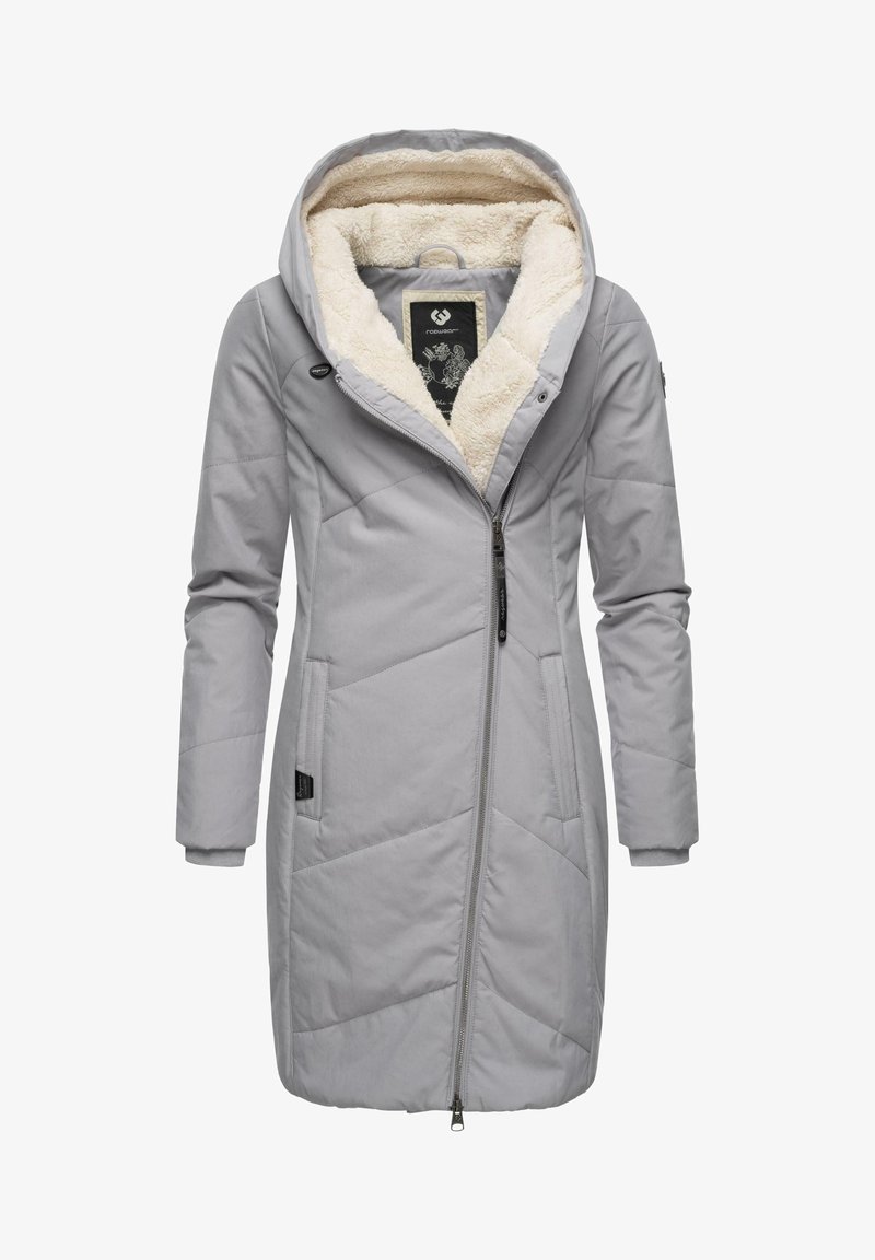 Hall proovikate, millel on tikandiku kujundus, pehme kreemja värvi fliisseesiga ja suur kapuuts. Lukuga sulgemine ja küljetaskud.