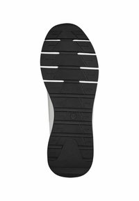 Semelle de chaussure en caoutchouc noir présentant un design texturé et à motifs avec des rainures pour l'adhérence et un logo circulaire près du centre.