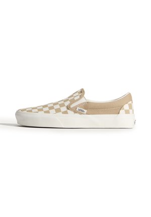 Beige og hvid slip-on Vans sko med hvid gummisål og mærkelabel på siden, vist i højre sideprofil.
