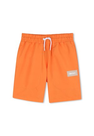Bright orange shorts with elastic waistband, white drawstring, front pockets, and a beige DKNY logo patch on the right leg.