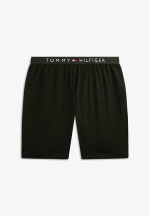 Shorts noirs longueur genou avec taille élastique arborant le texte "Tommy Hilfiger" et le logo en blanc, rouge et bleu.