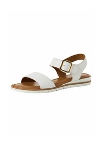 Des sandales blanches avec une large sangle avant, un accent de boucle sur une sangle de cheville, et une semelle intérieure beige clair sur une semelle blanche flexible.