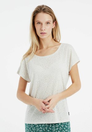 Lichtbeige shirt met korte mouwen met een subtiele luipaardprint tekstuur, ronde halslijn en een losse pasvorm.