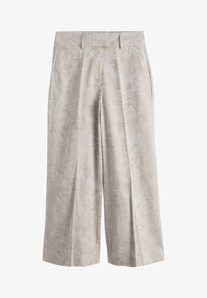 Béžové široké kalhoty s jemným vzorem listů, předními záhyby a postranními kapsami.