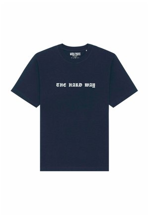 Navy blue cotton t-shirt with short sleeves and a crew neckline. Features the text "THE HARD WAY" in white Gothic font across the chest.