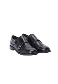 Chaussures en cuir noir avec un bout pointu, deux boucles ajustables, des détails perforés le long des bords et un petit talon.