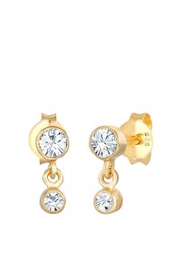 Guldøreringe med to klare, runde sten i et dråbe-design. Den større sten sidder ovenpå den mindre, begge med en poleret overflade.