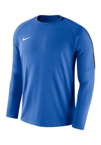 Långärmad sporttröja i blått tyg, med rundad halsringning, svarta detaljer på axlarna och en liten vit Nike-logotyp på bröstet.