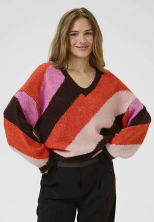 V-Ausschnitt Pullover mit auffälligen diagonalen Streifen in Orange, Rosa, Braun und Hellrosa. Hergestellt aus strukturiertem Stoff mit übergroßen Ärmeln.