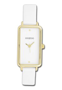 Montre rectangulaire blanche avec un cadran en métal doré, un visage blanc minimaliste, des aiguilles dorées et un bracelet en cuir blanc. Nom de la marque "OOZOO" visible.