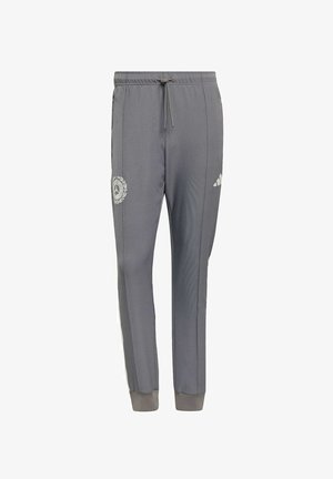 Pantaloni sportivi grigi in tessuto liscio, con vita elastica e coulisse, righe laterali e toppa con logo sulla gamba sinistra.