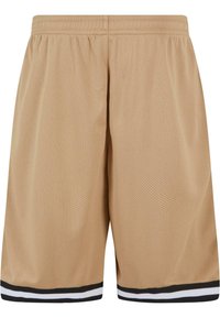 Shorts en mesh beige avec une taille élastique, présentant des accents rayés noirs et blancs à l'ourlet et une coupe ample.
