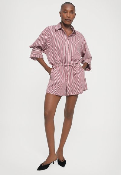 Striped short-sleeve romper in red and white. Features a collared neckline, elastic waist, and front button closure. Smooth fabric texture.