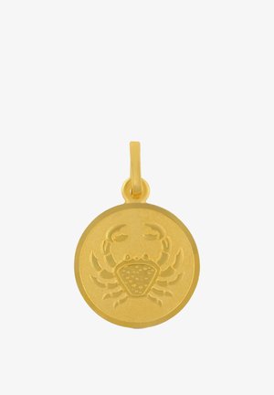 Pendentif rond en or avec un motif gravé de crabe et une petite boucle pour attacher à un collier ou un bracelet.