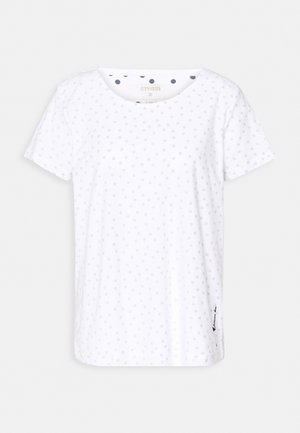 Bílé tričko s krátkým rukávem s jemnými šedými puntíky, kulatým výstřihem a malým detailem na lemu. Vyrobeno z měkké bavlněné látky.