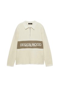 Pull-over crème avec col zippé et une bande marron contrastante portant le texte "DESIGN MOOD." Confectionné en matériau doux et texturé.
