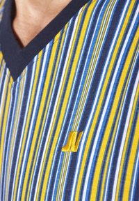Striped v-neck shirt in blue, yellow, and white, featuring a navy collar and a small embroidered logo in golden thread.