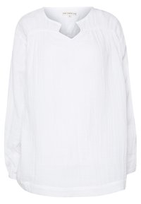 Chemise blanche à manches longues avec un décolleté en V, fabriquée dans un tissu léger, présentant une texture subtile et une coupe décontractée.