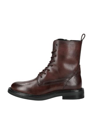 Bruine leren veterschoenen tot de enkel met een ronde neus, een textuur aan de oppervlakte, een lipje en een zwarte rubberen zool. Stikseldetails aan de zijkanten.