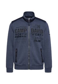 Marineblaue Zip-Jacke mit hohem Kragen, zwei seitlichen Taschen und bedruckten Textmotiven auf der Vorderseite, aus weichem, strukturiertem Stoff.