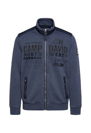 Navy zip-up jacket featuring a high collar, two side pockets, and printed text designs on the front, made of soft, textured fabric.