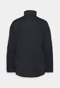 Navy jacket with a high collar, long sleeves, and buttoned cuffs. Features a sleek, smooth texture and minimalistic design.