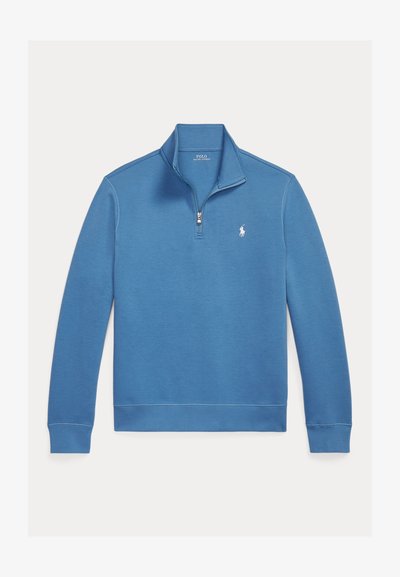 Pull-over bleu clair à fermeture éclair quart, en mélange de coton doux, avec poignets et ourlet côtelés, et un petit logo brodé sur la poitrine.