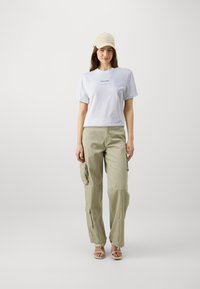 Calvin Klein MULTI LOGO REGULAR T-SHIRT - Tricou basic - bright white